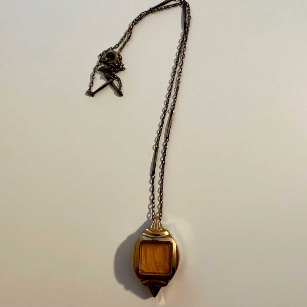 Vintage necklace with yellow feather